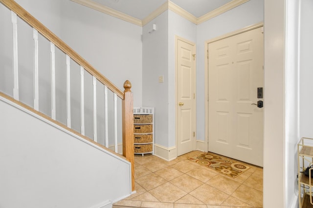 entrance foyer featuring ornamental molding and light tile patterned flooring