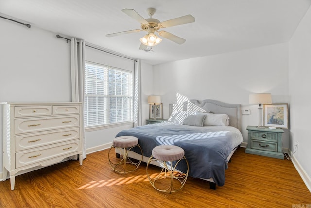 bedroom featuring light hardwood / wood-style floors and ceiling fan