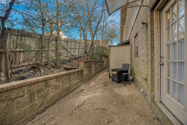 view of property exterior featuring a patio area