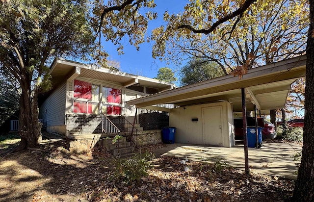 view of side of home featuring a carport