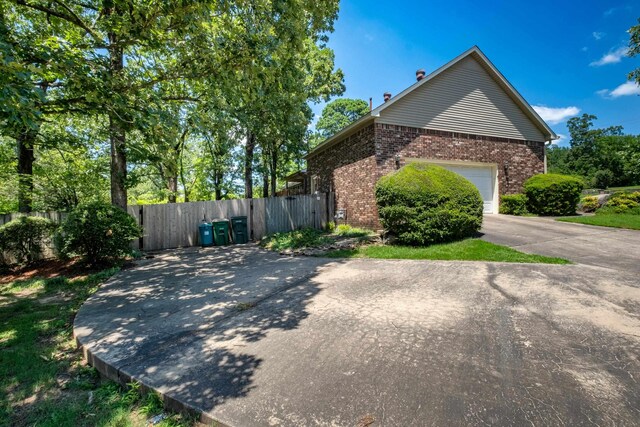 view of side of property with a garage