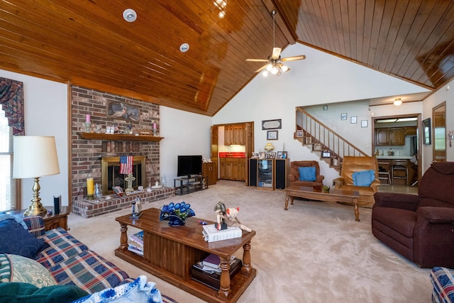 carpeted living room featuring high vaulted ceiling, a brick fireplace, beam ceiling, and wooden ceiling