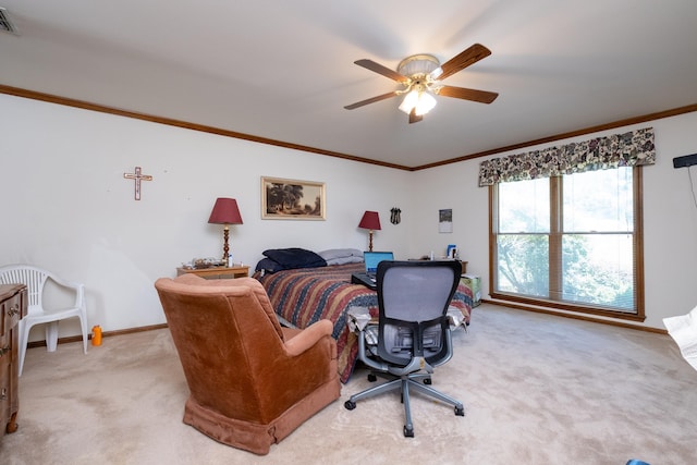 carpeted bedroom featuring ceiling fan and ornamental molding