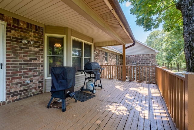 deck featuring a grill