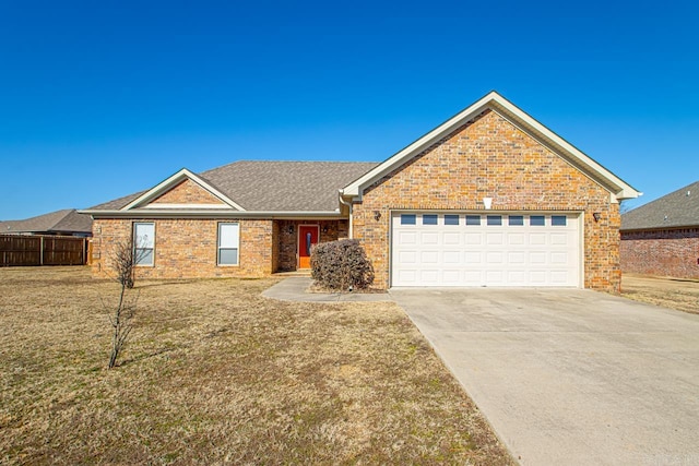 view of front of home featuring a garage and a front lawn