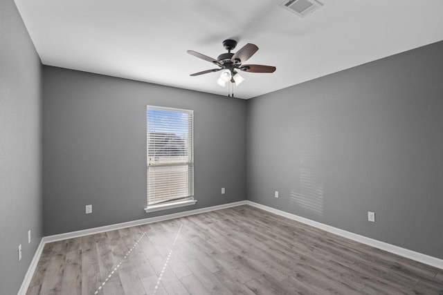 unfurnished room featuring light hardwood / wood-style floors and ceiling fan