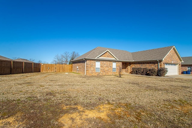 view of front of home featuring a garage and a front lawn