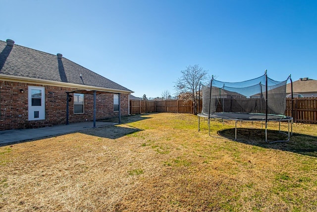 view of yard with a trampoline