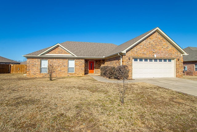 ranch-style home featuring a front yard and a garage