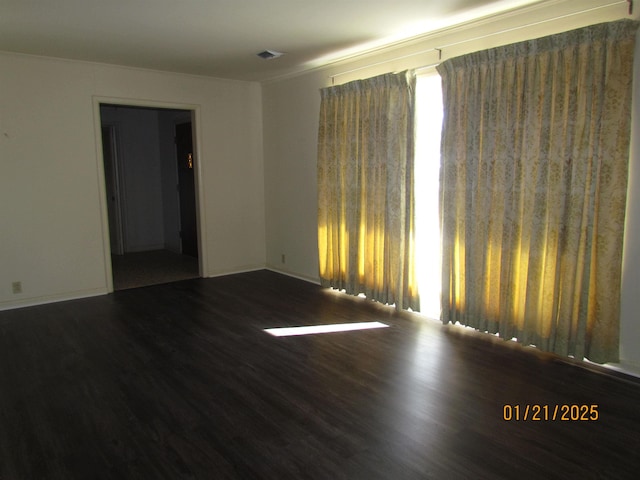 empty room featuring dark hardwood / wood-style floors