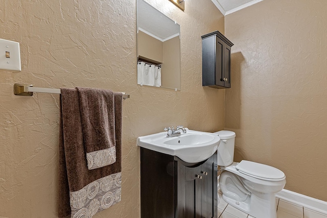 bathroom featuring crown molding, toilet, tile patterned flooring, and vanity