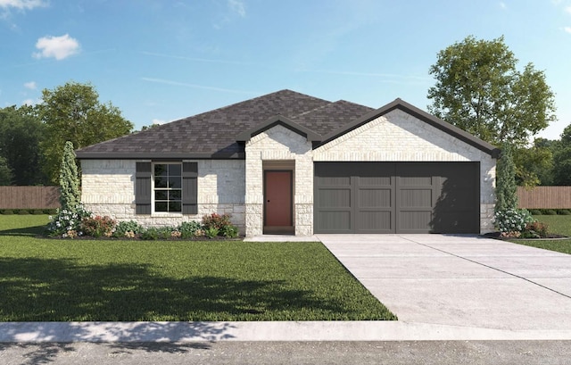 view of front of property with a front yard and a garage