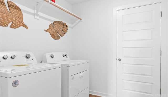 washroom with separate washer and dryer