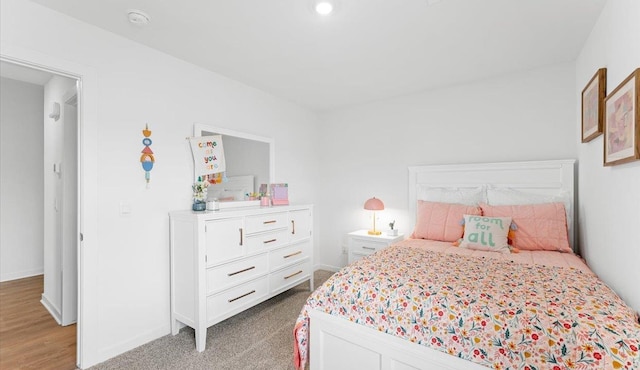 bedroom with light colored carpet