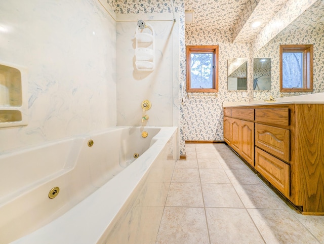 bathroom featuring tile patterned flooring, a relaxing tiled tub, lofted ceiling, and vanity