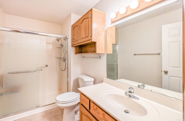 bathroom featuring vanity, toilet, walk in shower, and a textured ceiling