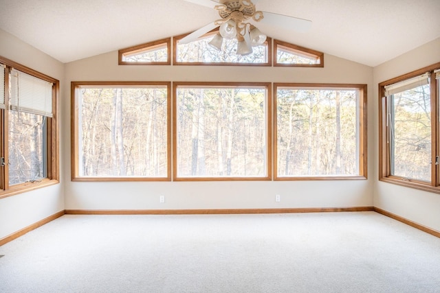 unfurnished sunroom with vaulted ceiling and ceiling fan