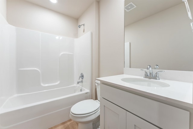 full bathroom featuring visible vents, toilet, wood finished floors, vanity, and  shower combination