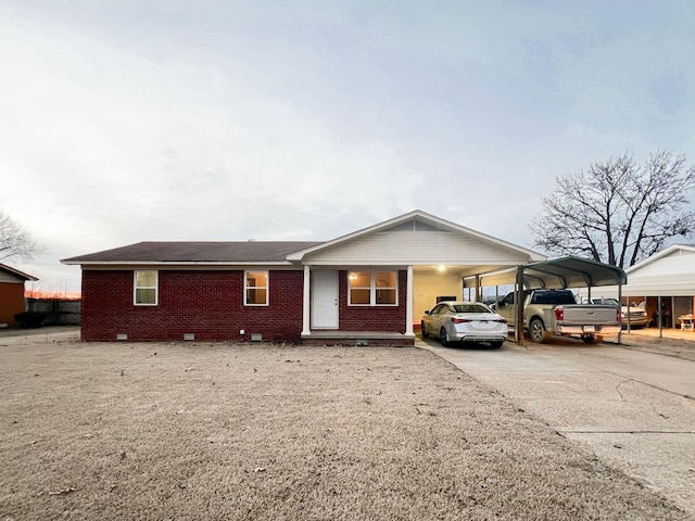 single story home featuring a carport