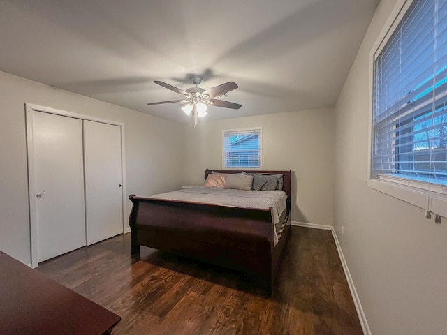 bedroom featuring ceiling fan, dark hardwood / wood-style flooring, and a closet