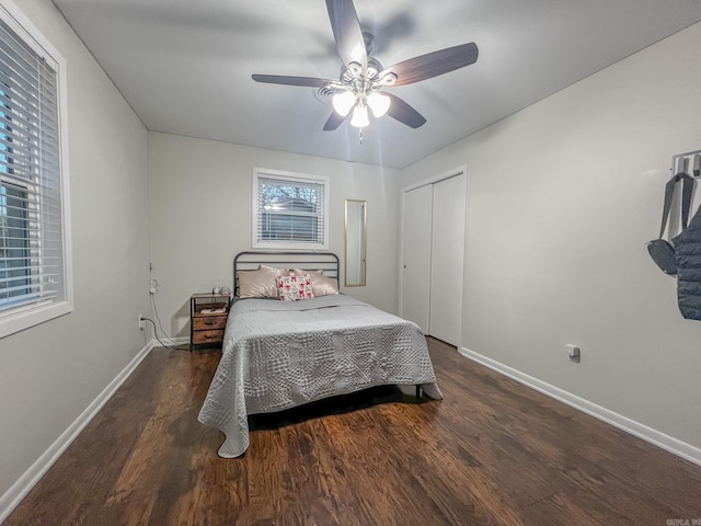 bedroom featuring a closet, ceiling fan, and dark wood-type flooring