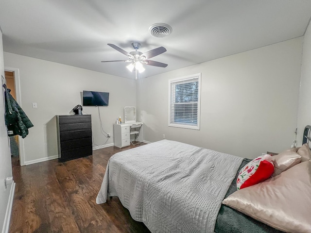 bedroom featuring ceiling fan and dark hardwood / wood-style flooring