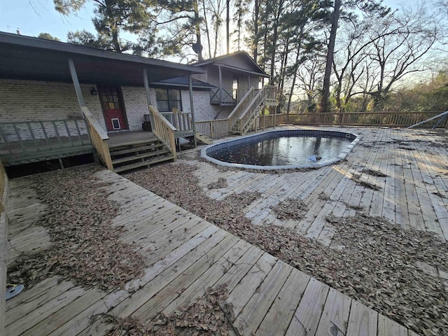 view of pool featuring a wooden deck