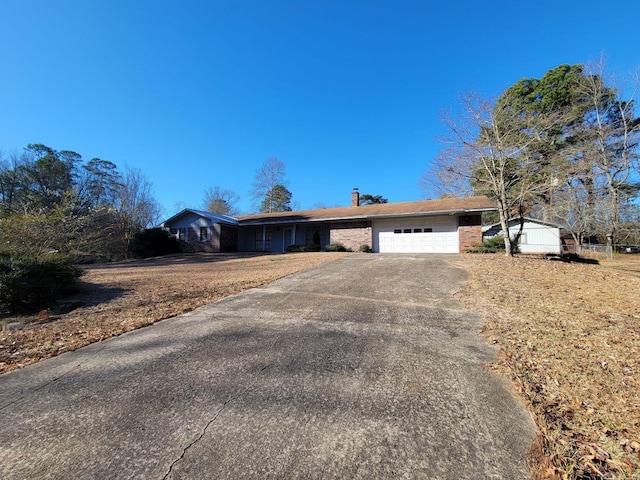 ranch-style home featuring a garage