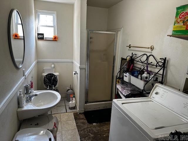 laundry area featuring sink and washer / clothes dryer