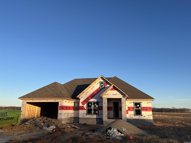 unfinished property featuring a garage