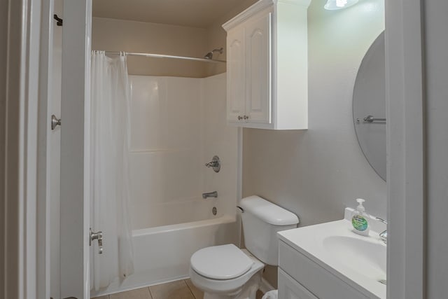 full bathroom featuring vanity, toilet, shower / bath combo with shower curtain, and tile patterned flooring