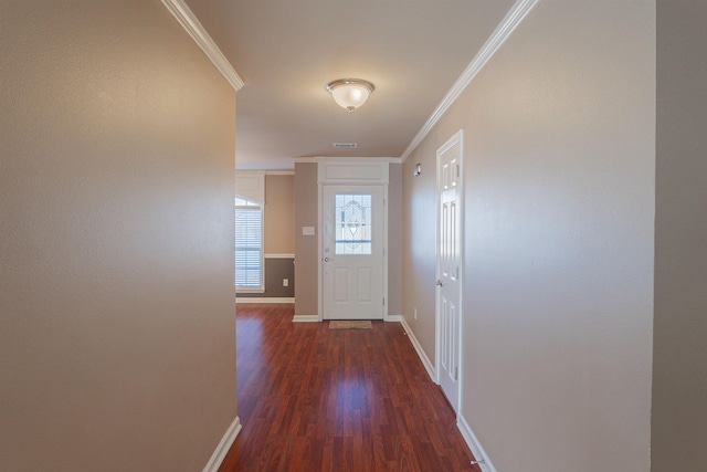 doorway to outside with dark hardwood / wood-style floors and ornamental molding