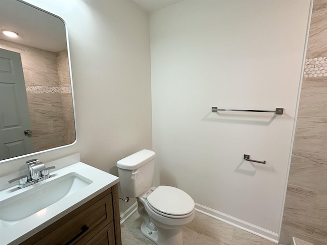 bathroom with toilet and vanity