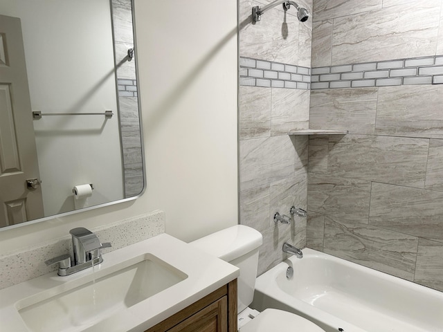 full bathroom featuring vanity, toilet, and tiled shower / bath combo