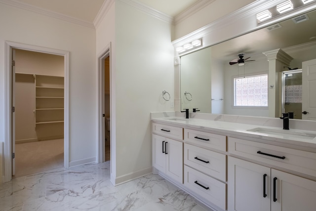 bathroom featuring vanity, ceiling fan, crown molding, and a shower with shower door