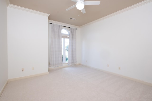 unfurnished room with light carpet, ceiling fan, and ornamental molding