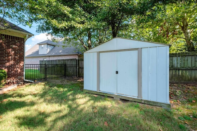 view of outbuilding featuring a yard