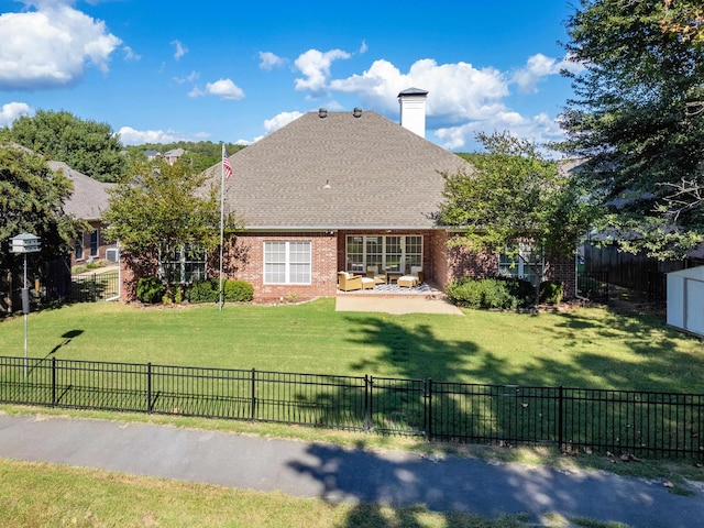 back of house featuring a patio and a lawn