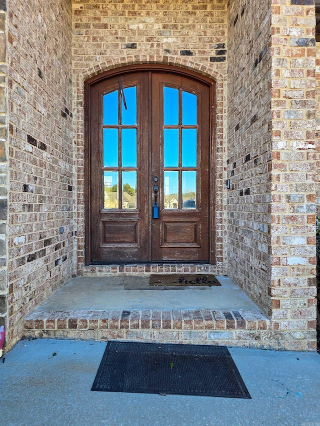 property entrance featuring french doors