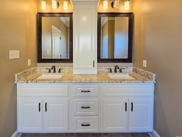 bathroom with vanity and crown molding