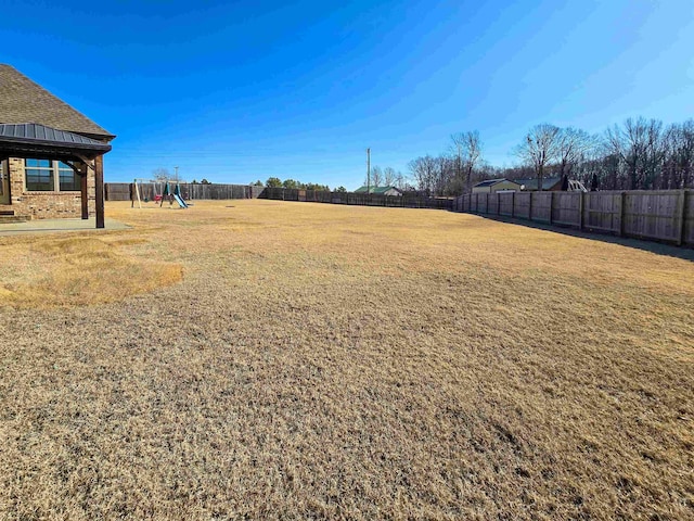 view of yard with a playground and a gazebo