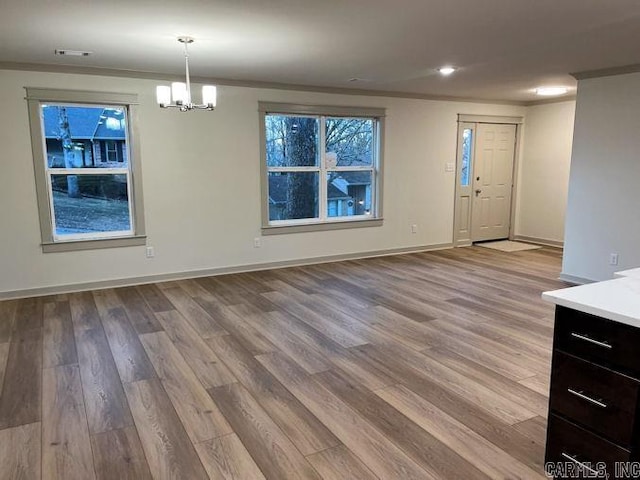 interior space with a chandelier and light wood-type flooring