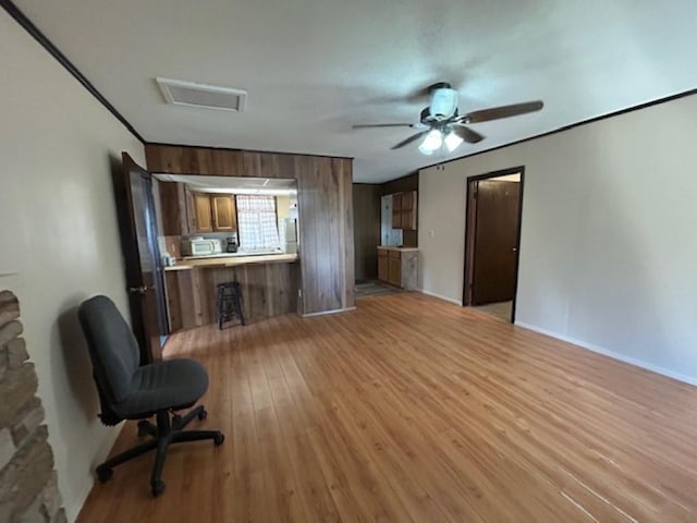 living room with light hardwood / wood-style floors and ceiling fan