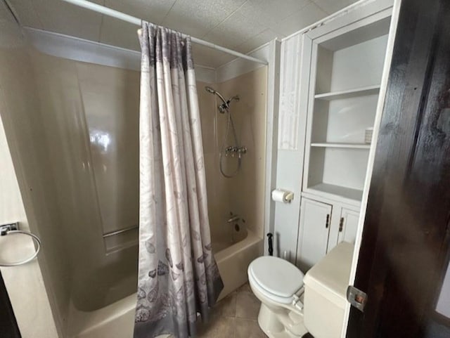 bathroom featuring toilet, shower / tub combo, and tile patterned flooring