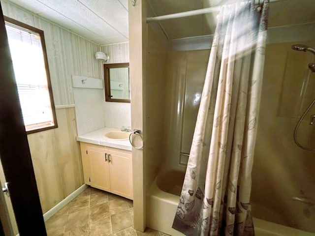 bathroom with vanity and shower / bath combination with curtain