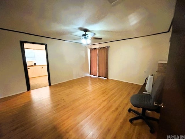 unfurnished room with ceiling fan and hardwood / wood-style floors