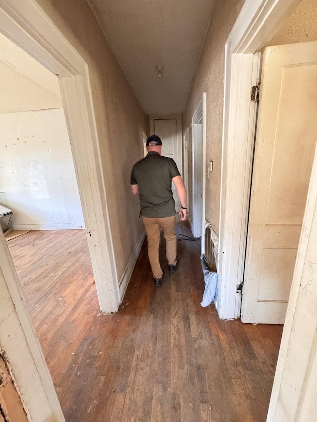 hallway featuring dark hardwood / wood-style floors