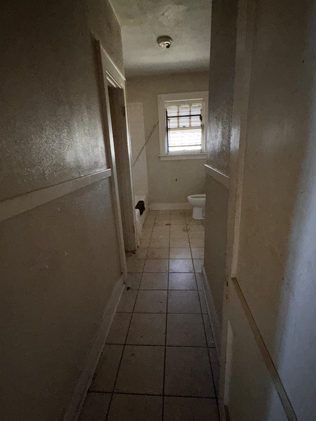 bathroom with tile patterned floors and toilet