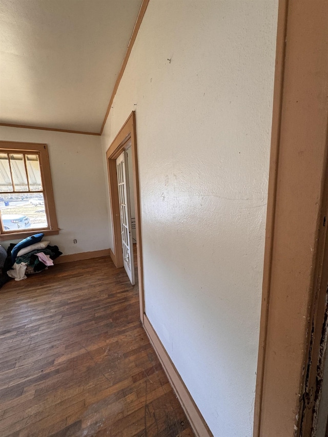 hall with ornamental molding and dark hardwood / wood-style flooring