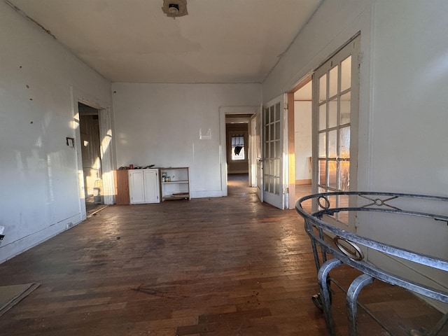 corridor with dark hardwood / wood-style floors